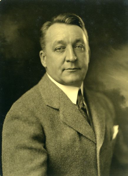 Portrait of Theodore Wright Griggs facing left. He is wearing what appears to be a mohair or cashmere suit jacket.