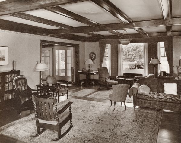 A view of the old Cooper living room, with furnishings and a large front window. Henry S. Cooper was the original owner of the Dunmovin estate.