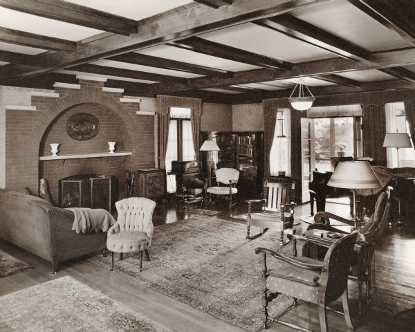 A view of the old Cooper living room with furnishings and a fireplace. Henry S. Cooper was the original owner of the Dunmovin estate. 