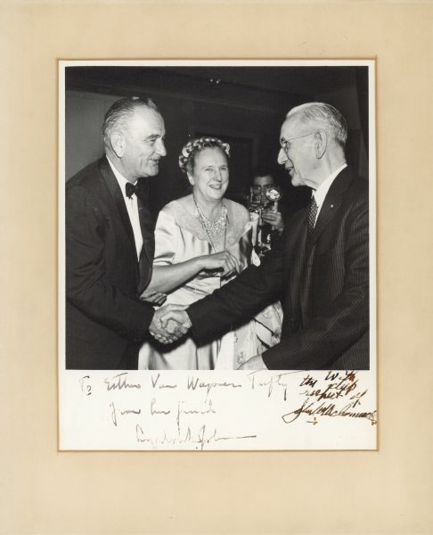Esther Van Wagoner Tufty, a nationally prominent journalist, whose papers are part of the collections of the Wisconsin Historical Society, chatting with President Lyndon B. Johnson, and John D. McCormick, speaker of the House.  Both men autographed the picture for her.