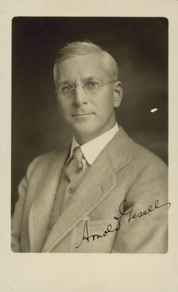 Quarter-length studio portrait of Arnold Gesell, which includes his autograph.