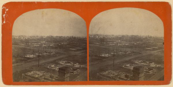 Stereograph of an elevated view of the ruins after the fire of April 28, 1875.