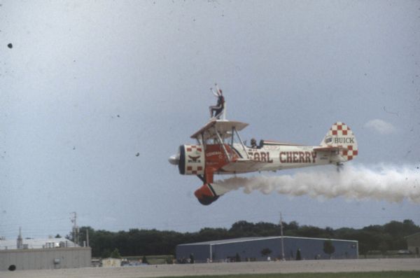 Stunt flyer Earl Cherry performing at the Experimental Aircraft Association AirVenture fly-in.