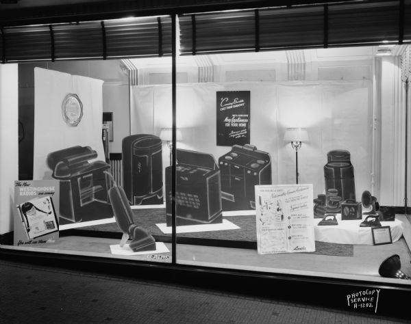 Leath's Incorporated, 117 to 119 State Street, display window containing silhouettes of electric household appliances, with a sign that reads: "We'll soon have new appliances for your home."