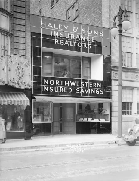 Haley & Sons, building facade, "Insurance, Realtors, Northwestern Insured Savings," 124 State Street. In 1940 it became home of the First Federal Savings and Loan Association of Madison formerly known as the Northwestern Savings, Building & Loan Association.