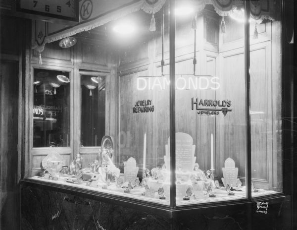 Harrold's jewelry window store display, 220 State Street, featuring jewelry and tableware.