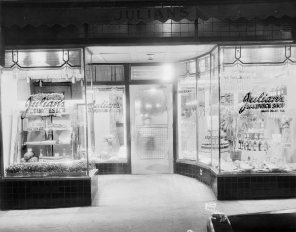 Julian's Delicatessen and Sandwich Shop, 226 State Street. Julius Giller proprietor. A boy is standing inside the entrance looking through the door.
