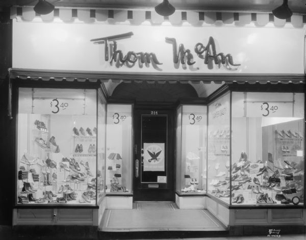 Thom McAn shoe store, 214 State Street, display windows.