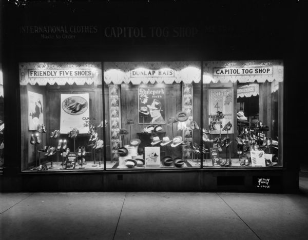 Capitol Tog Shop, 231 State Street, display window with "Dunlap" hats and "Friendly Five" shoes for men. "International clothes made to order."
