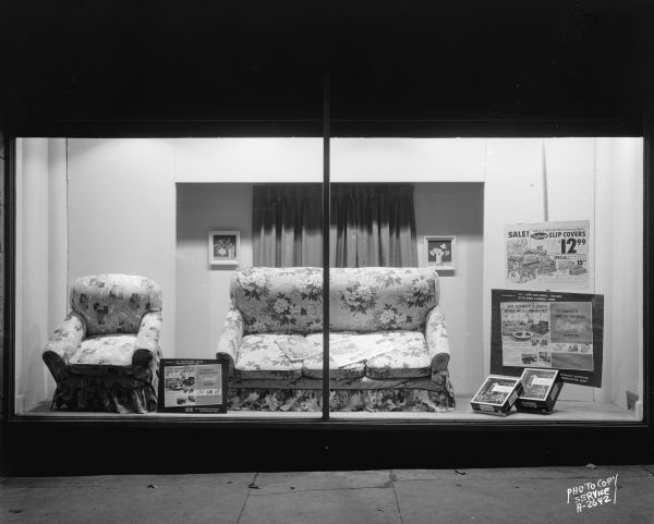 Display of Customagic slip covers on a sofa and chair in a show window of Hill's Department Store, 202 State Street.