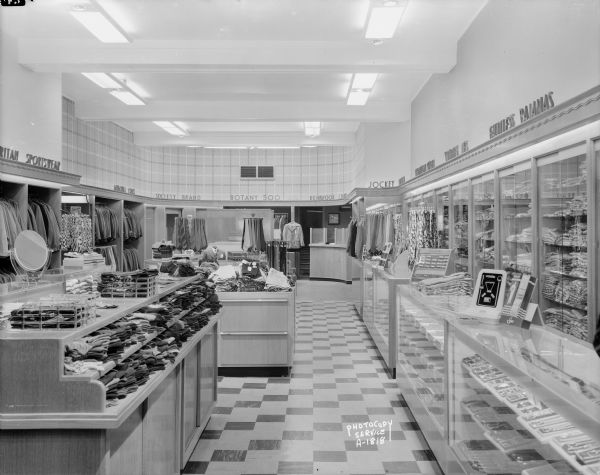 Speth's Clothing Store, 222 State Street. Interior view showing counters, and wall niches with hanging garments.
