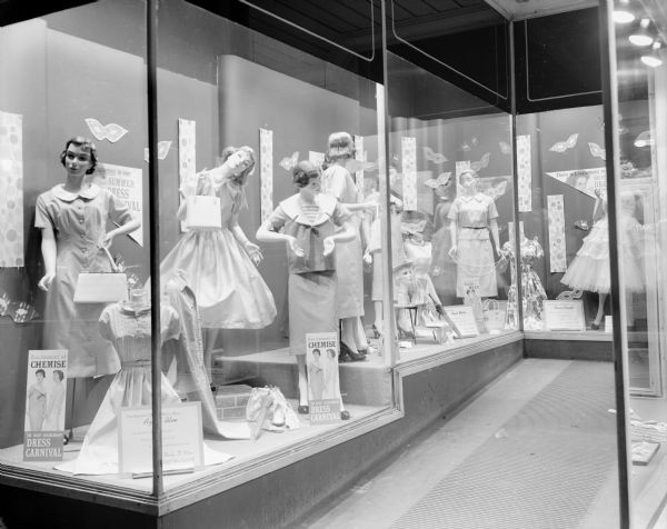 Hill's Department Store, 202 State Street, display window featuring summer dresses with three mannequins and a sign stating "Excitement of Chemise".