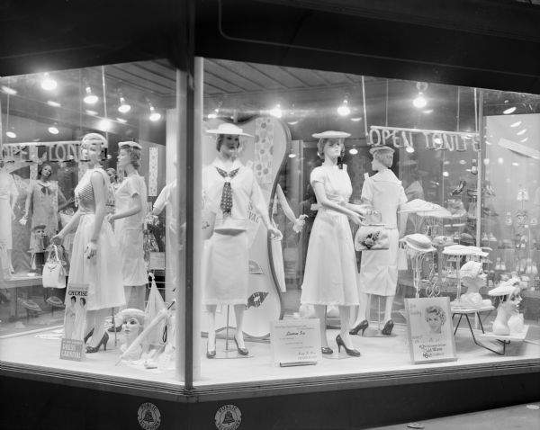Hill's Department Store, 202 State Street, display window featuring summer dresses and hats with five mannequins and a sign stating "summer Dress Carnival".
