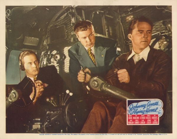 Lobby card for the 1946 film Johnny Comes Flying Home.  Harry Morgan and Charles Russell pilot a plane while Richard Crane stands between them.  They are all wearing nice clothes.