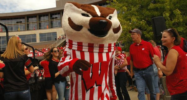 Bucky Badger mascot with people at Camp Randall.