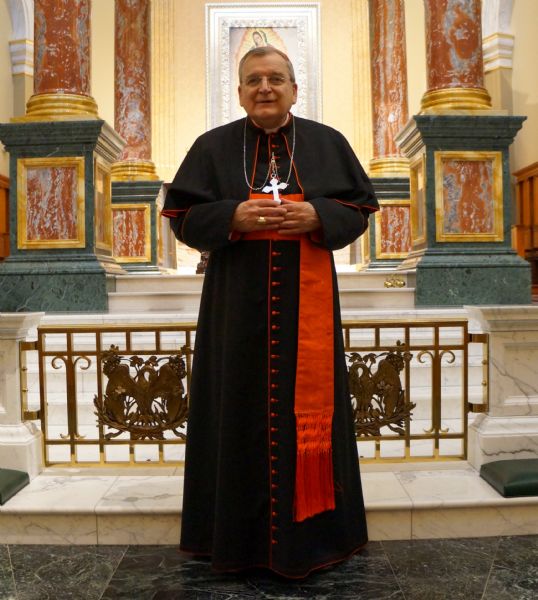 Cardinal Raymond Burke standing in front of an altar at the Shrine of Our Lady of Guadalupe.