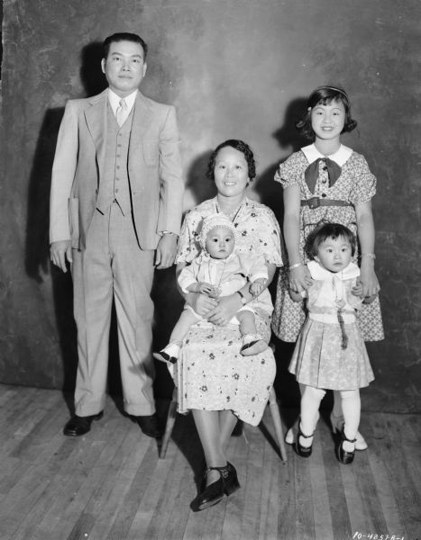 Portrait of Charles May family. Father and mother, and three children.