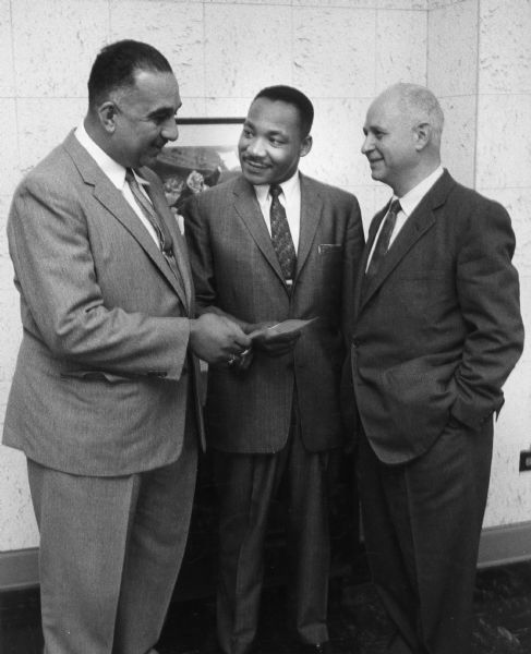 A casual group portrait of Russell Lasley, Martin Luther King Jr., and Ralph Helstein.