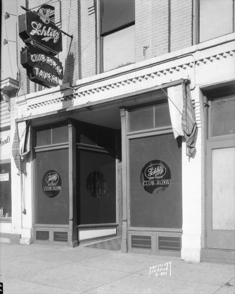 Club Royal Tavern, 122 East Washington Avenue, exterior view showing Schlitz Beer sign.