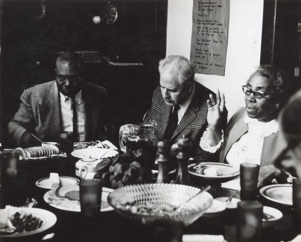 From left to right are Esau Jackson, Morris Mitchell and Septima Clark. They are attending a dinner at Highlander Folk School.