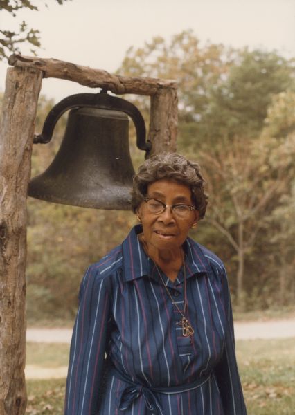 Septima Clark poses in front of the Freedom Bell.
