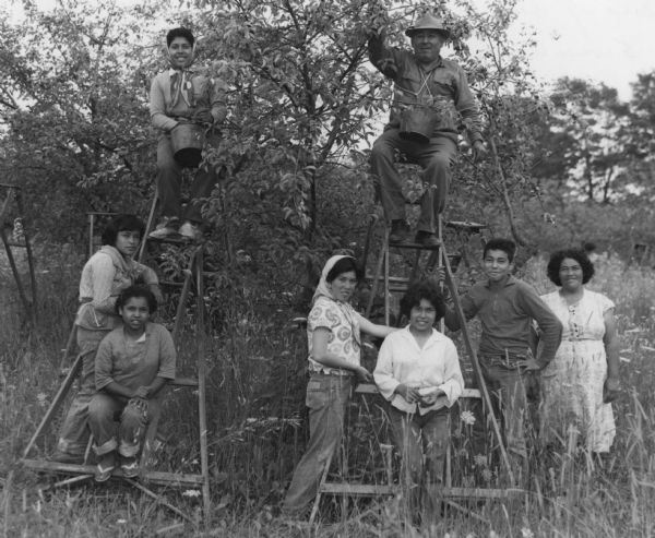 Migrant workers from Mexico, Joe Rio, his wife, and six of their eleven children, pose for a photo during a cherry harvest.