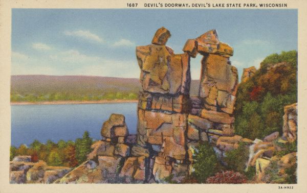 Colorized postcard of the rock formation called the Devil's Doorway in Devil's Lake State Park. Trees can be seen to the right and below. The lake, bluffs and sky are visible in the background. The text above reads: "Devil's Doorway, Devil's Lake State Park, Wisconsin."